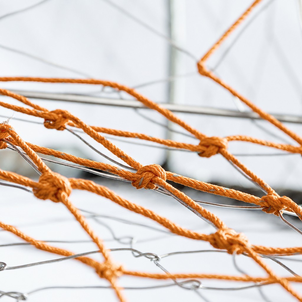 Tunnel and weaving photo with orange twine